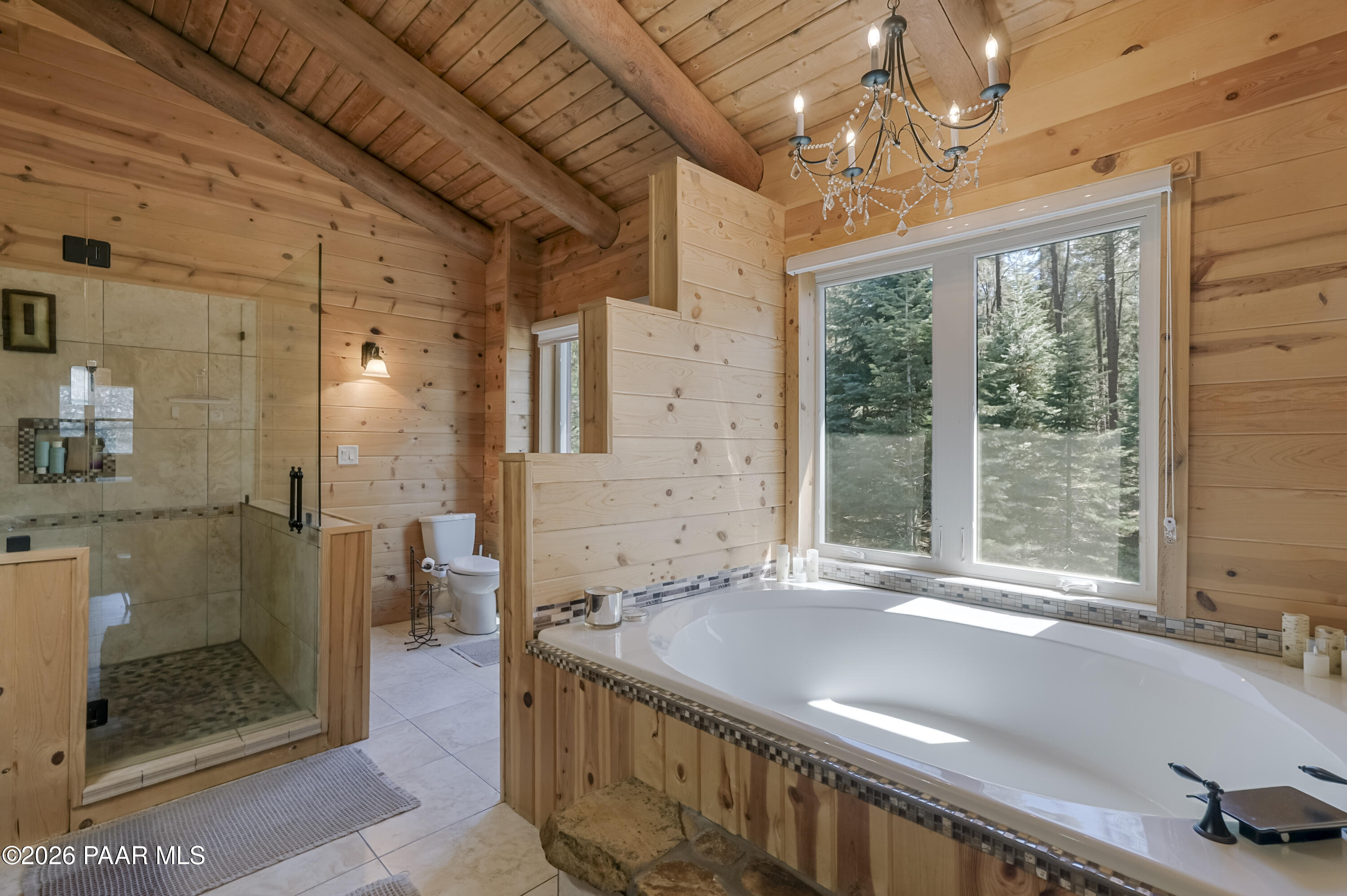 8105 South Comstock Mine Road Prescott, AZ 86303 - Photo 19 of 61 a view of a bathroom with a tub shower and sink