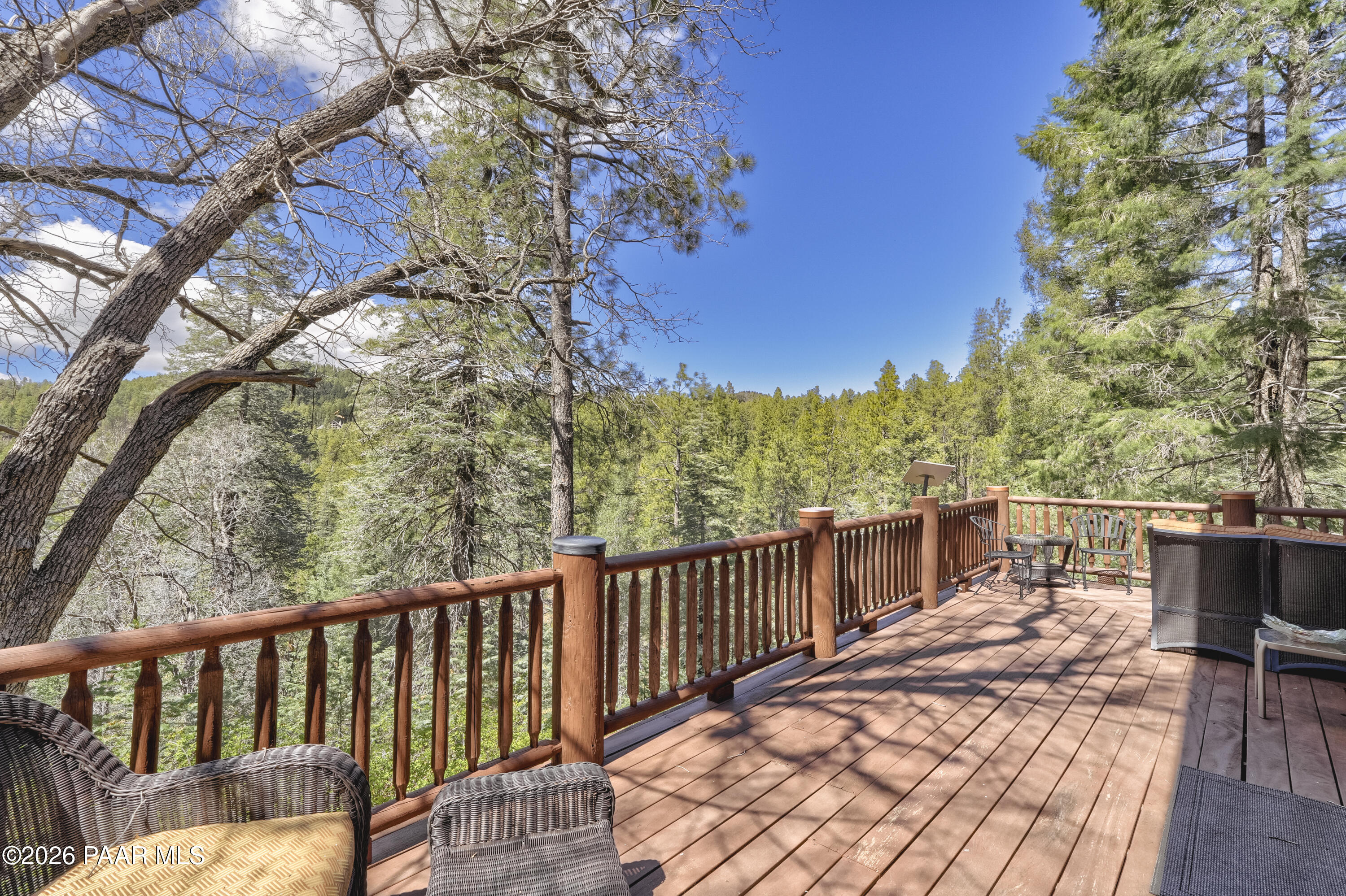 8105 South Comstock Mine Road Prescott, AZ 86303 - Photo 23 of 61 a view of a balcony with wooden floor and fence