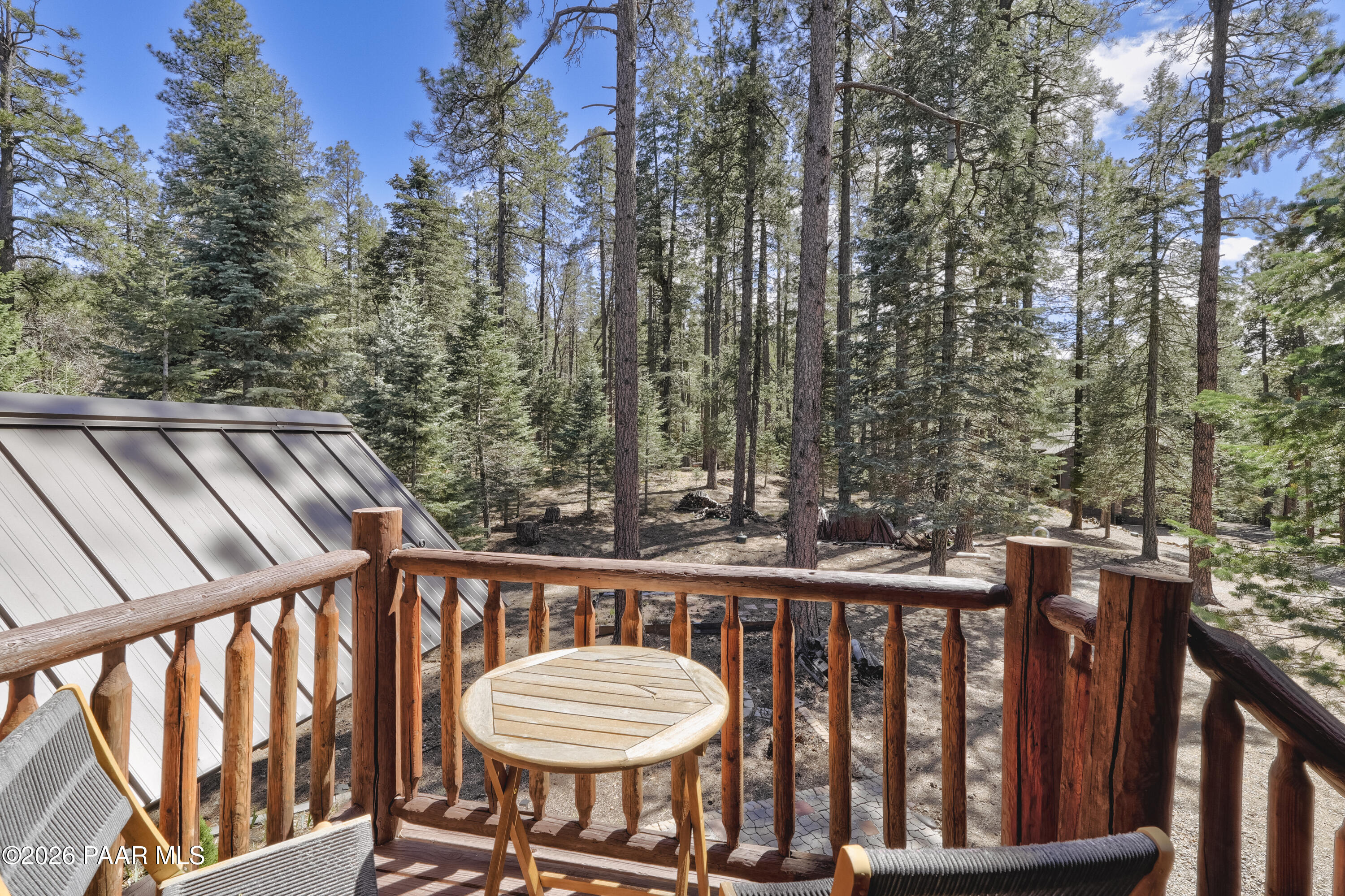 8105 South Comstock Mine Road Prescott, AZ 86303 - Photo 25 of 61 a view of balcony with wooden floor and outdoor seating
