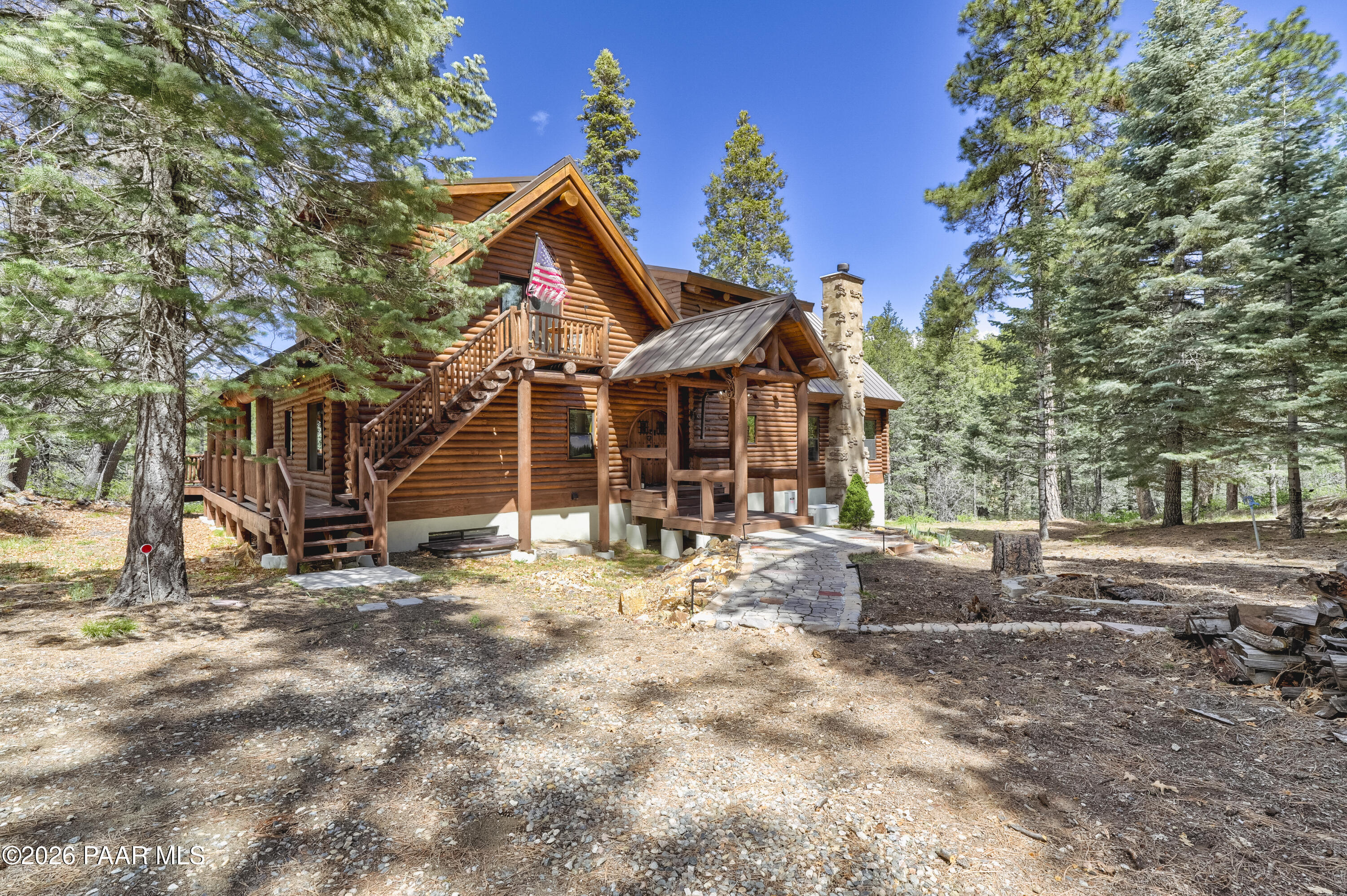 8105 South Comstock Mine Road Prescott, AZ 86303 - Photo 3 of 61 a view of a house with backyard and sitting area