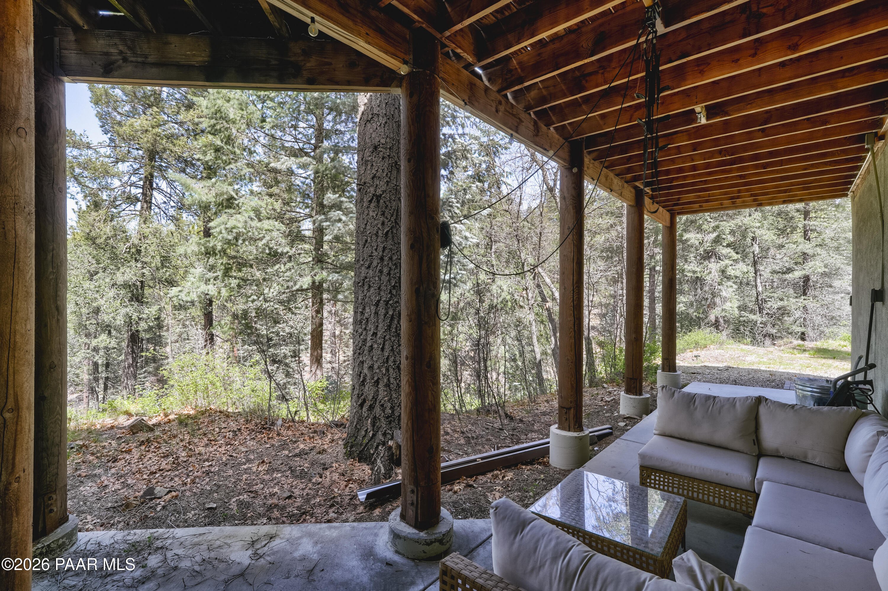 8105 South Comstock Mine Road Prescott, AZ 86303 - Photo 38 of 61 a living room with furniture and a floor to ceiling window