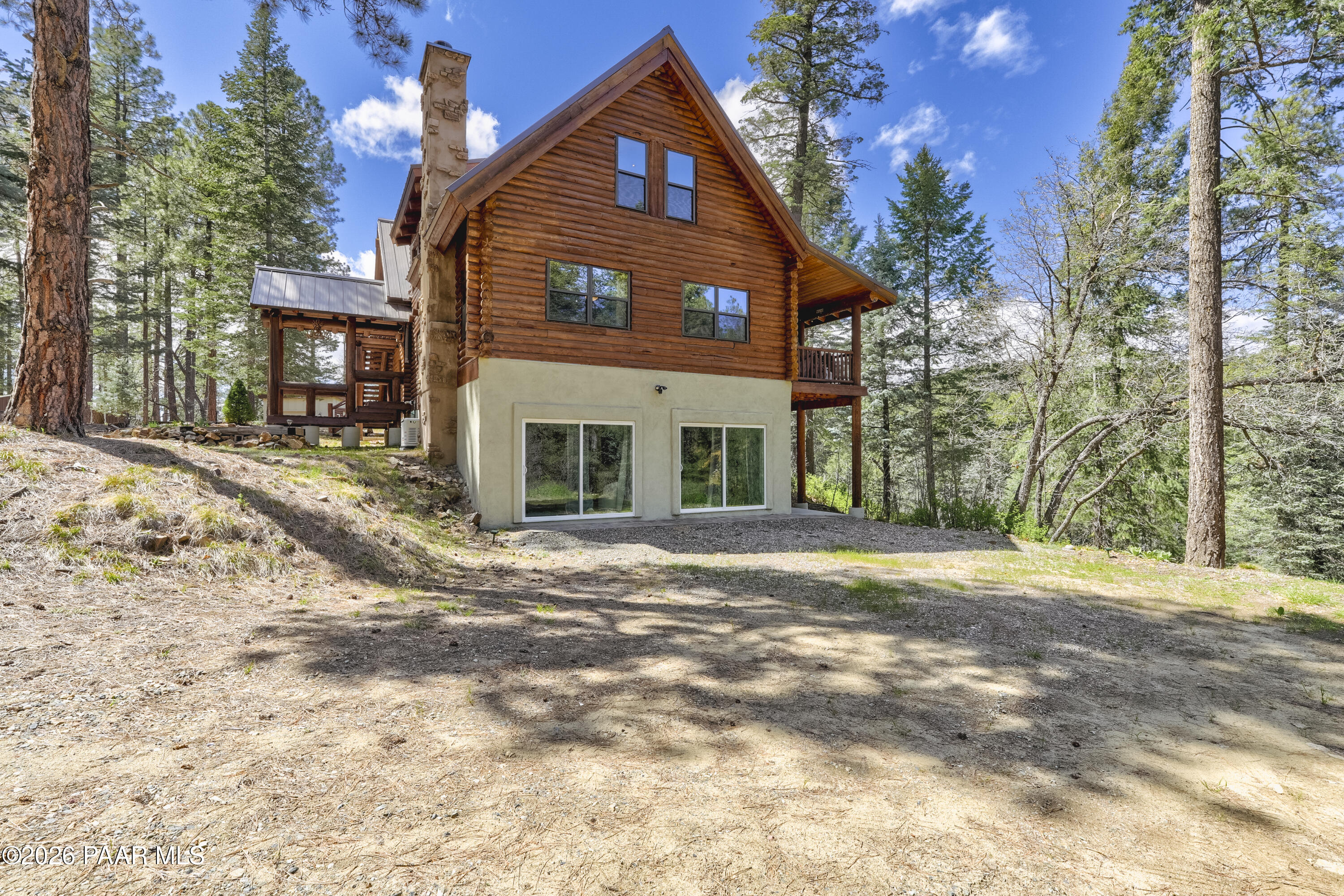 8105 South Comstock Mine Road Prescott, AZ 86303 - Photo 41 of 61 a front view of a house with a yard