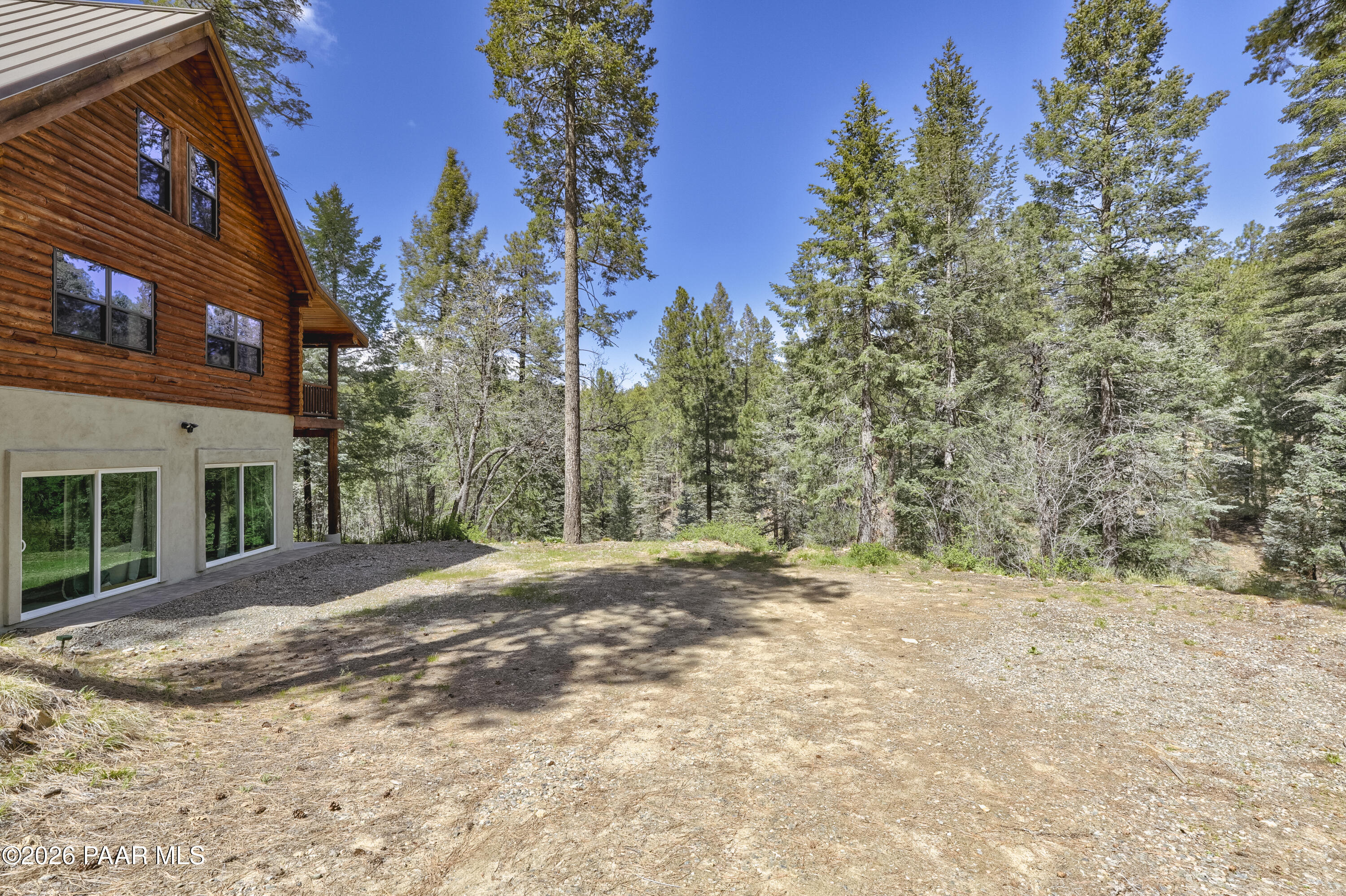 8105 South Comstock Mine Road Prescott, AZ 86303 - Photo 42 of 61 a view of a yard with plants and trees