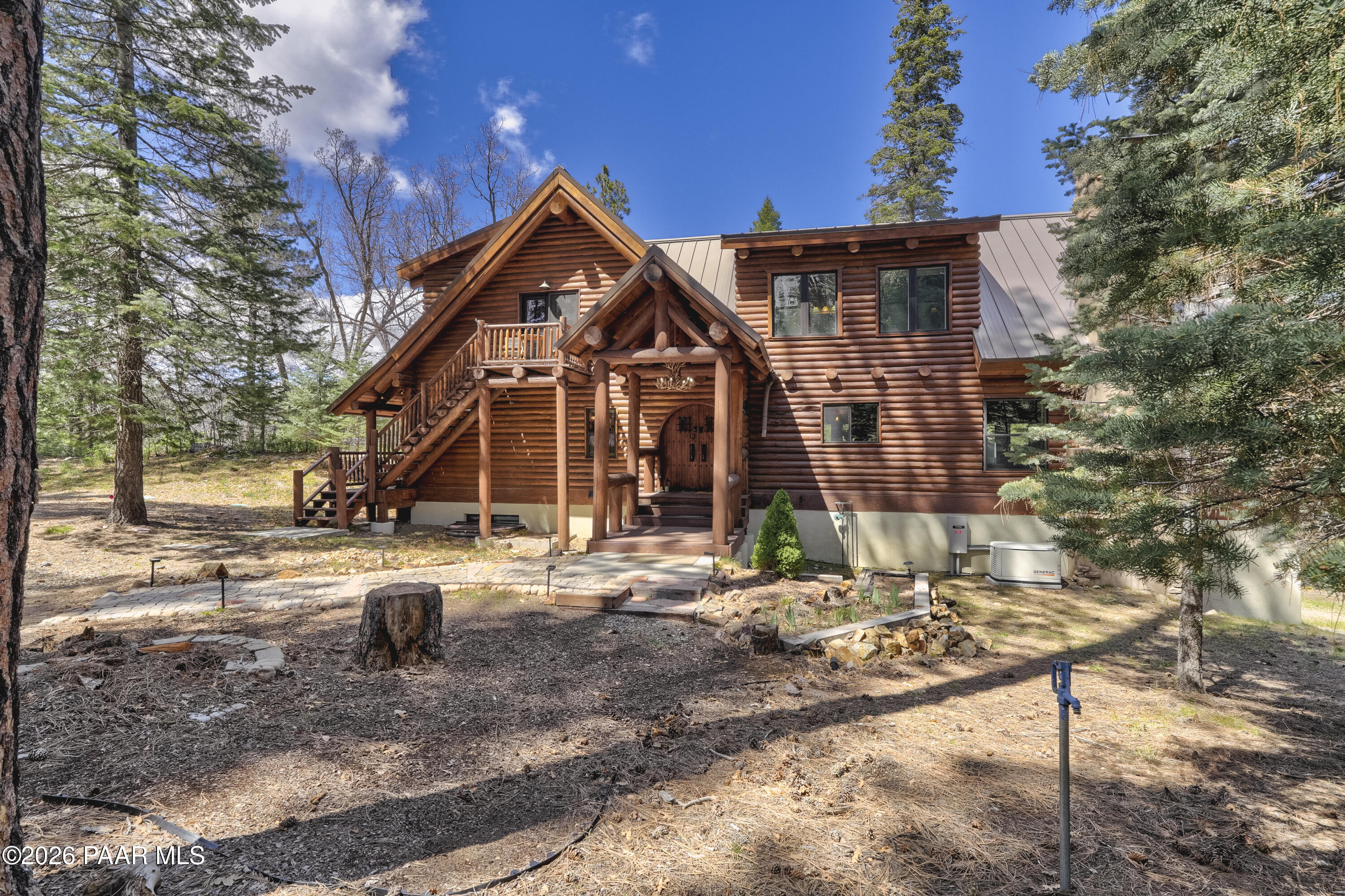 8105 South Comstock Mine Road Prescott, AZ 86303 - Photo 46 of 61 a front view of a house with garden