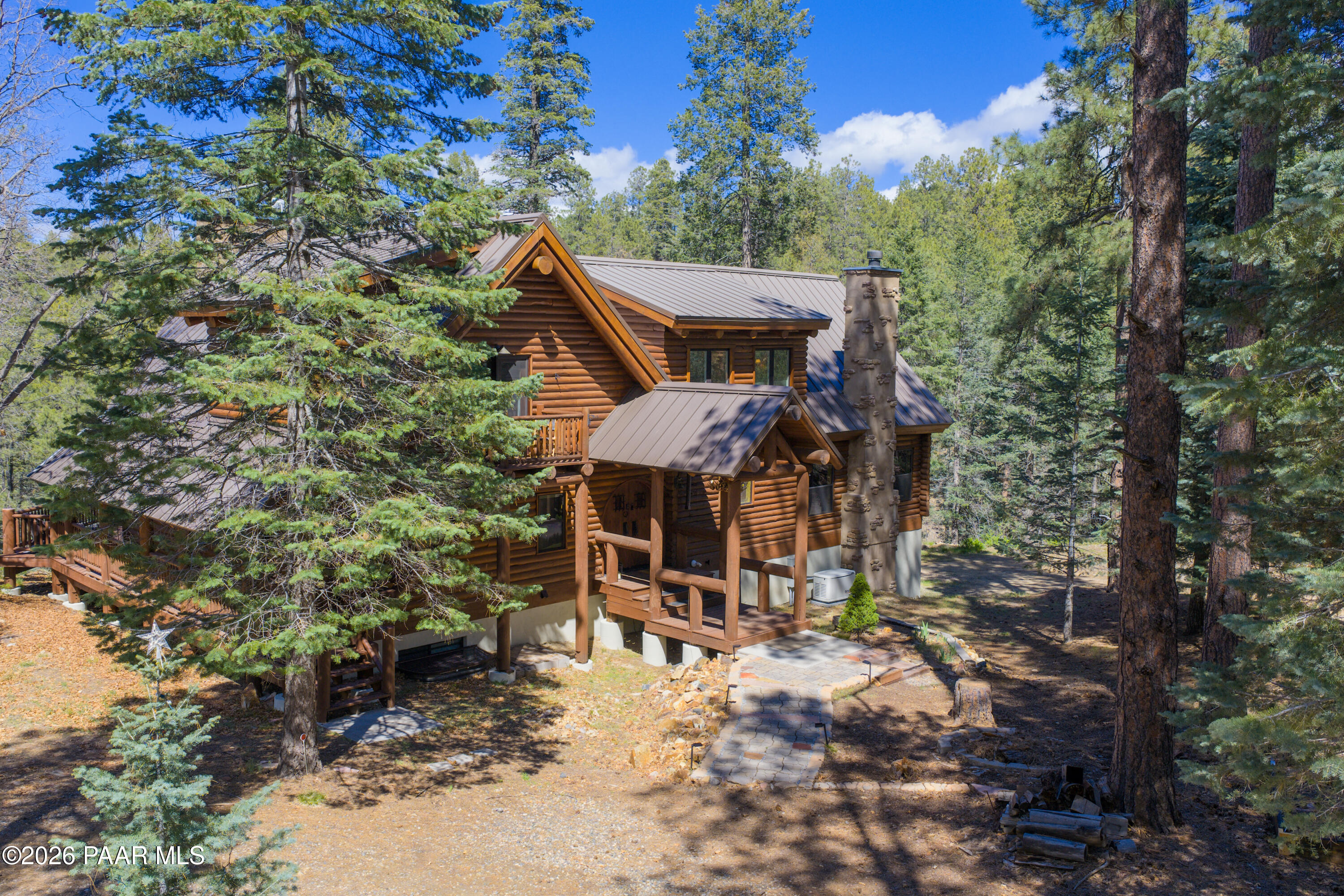 8105 South Comstock Mine Road Prescott, AZ 86303 - Photo 48 of 61 a view of a patio with table and chairs with wooden fence and floor