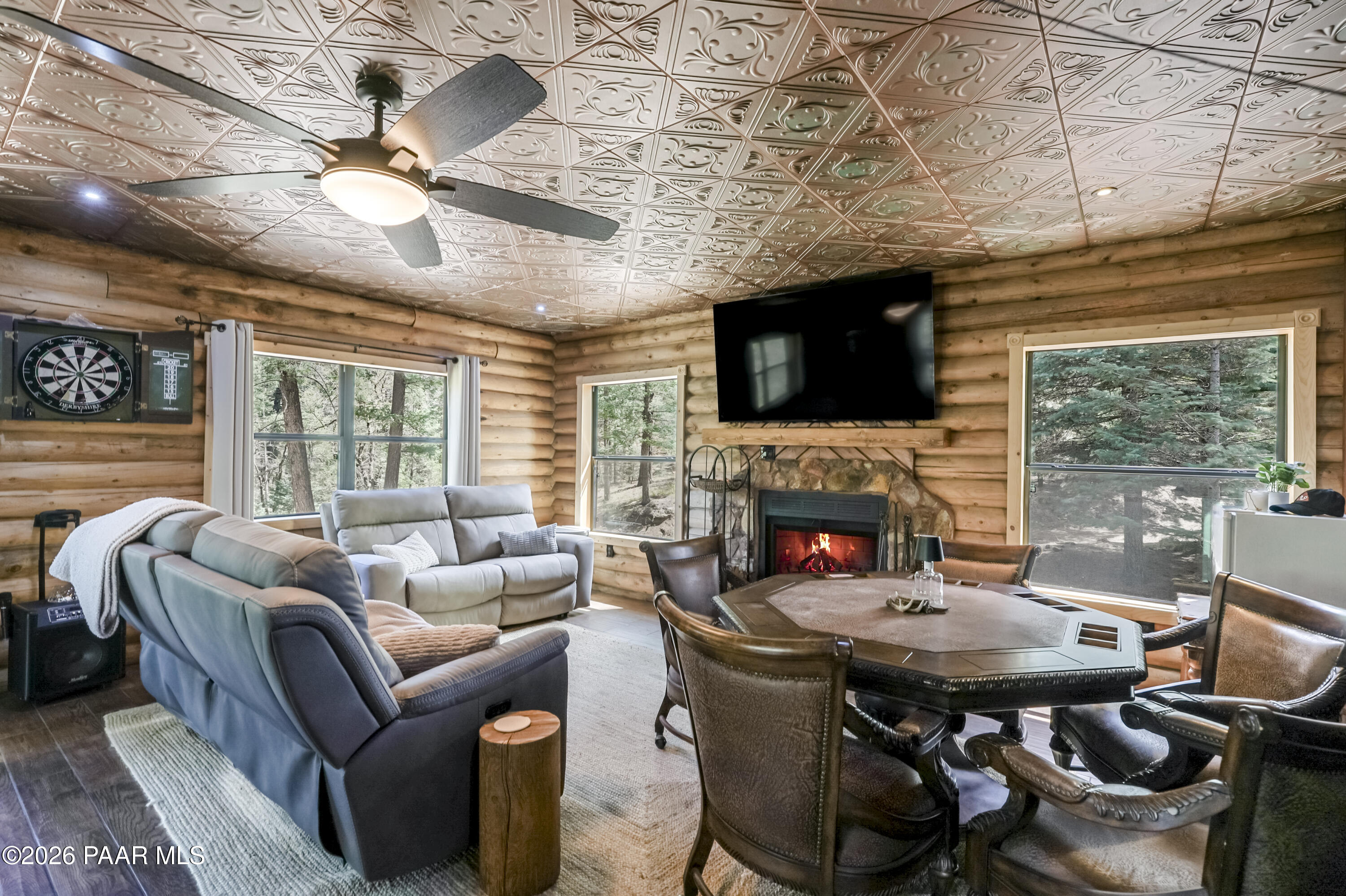 8105 South Comstock Mine Road Prescott, AZ 86303 - Photo 8 of 61 a living room with furniture a fireplace and a flat screen tv