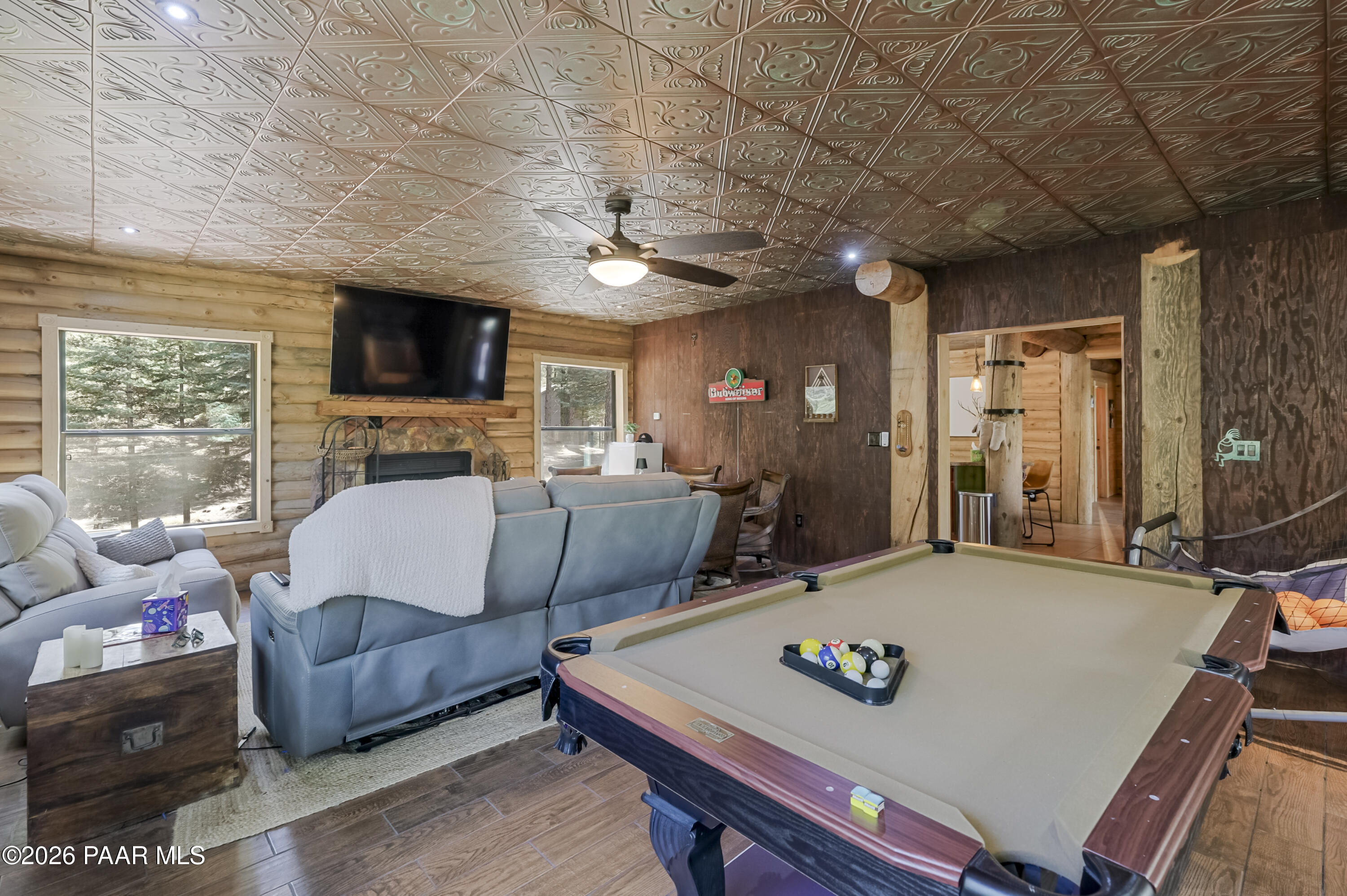 8105 South Comstock Mine Road Prescott, AZ 86303 - Photo 10 of 61 a living room with furniture a flat screen tv and a large window