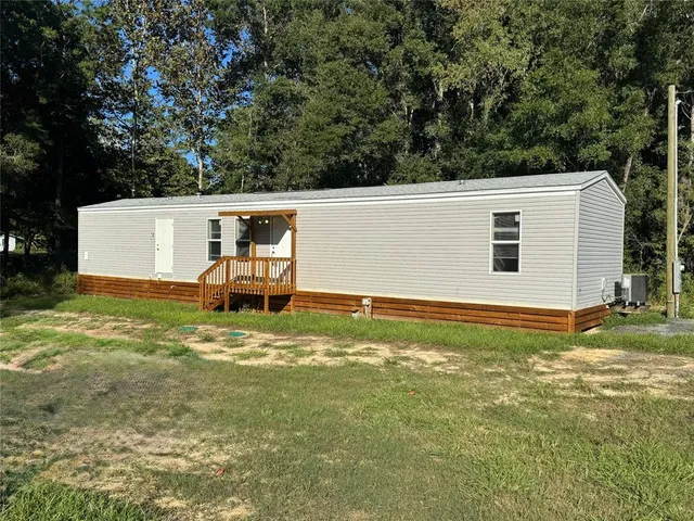 a view of a pool with a yard