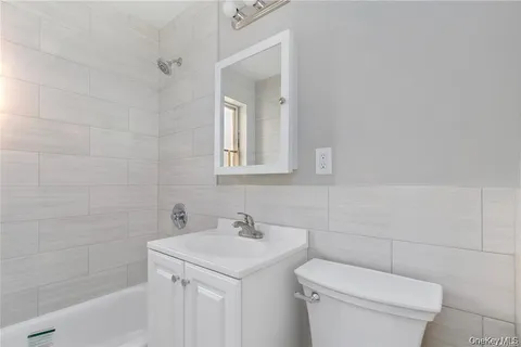 a bathroom with a sink toilet and vanity