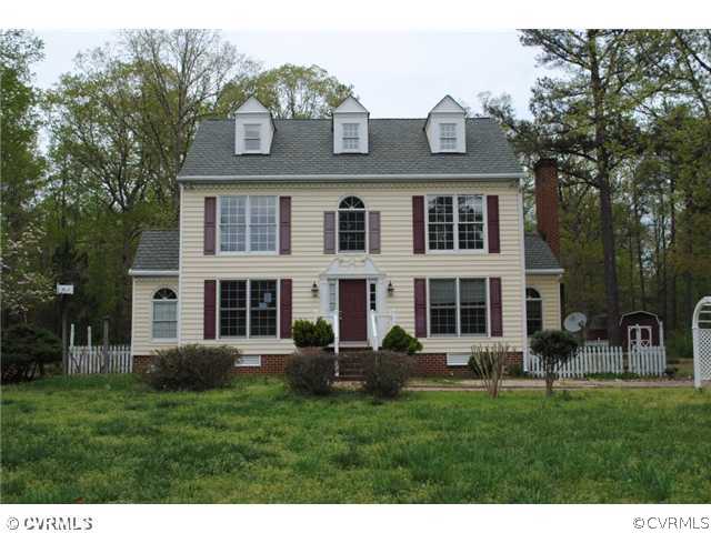 13620 Spring Run Road Midlothian, VA 23112 - Photo 1 of 15 a front view of a house with a yard