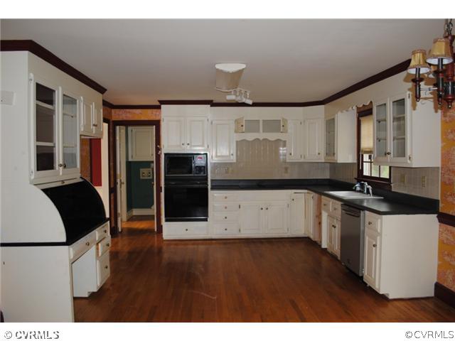 13620 Spring Run Road Midlothian, VA 23112 - Photo 6 of 15 a kitchen with stainless steel appliances a refrigerator sink and cabinets