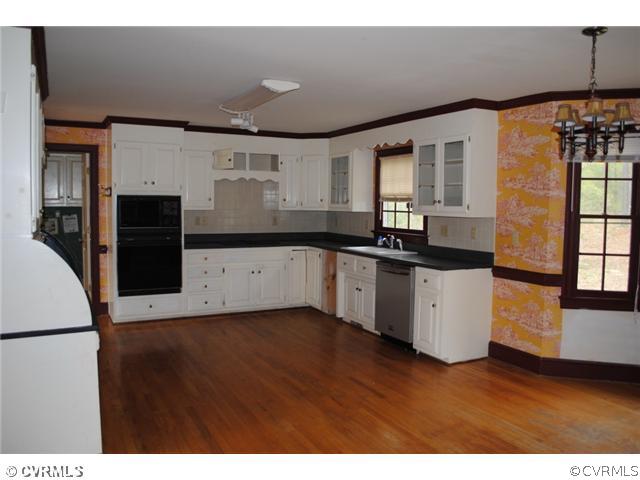 13620 Spring Run Road Midlothian, VA 23112 - Photo 7 of 15 a kitchen with granite countertop a sink and a refrigerator