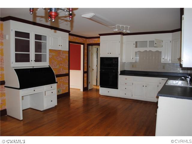 13620 Spring Run Road Midlothian, VA 23112 - Photo 8 of 15 a kitchen with cabinets and stainless steel appliances