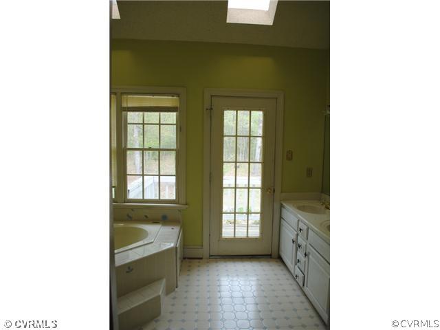 13620 Spring Run Road Midlothian, VA 23112 - Photo 10 of 15 a bathroom with a tub and shower