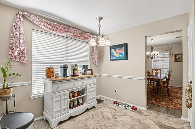 a view of a livingroom with furniture and window