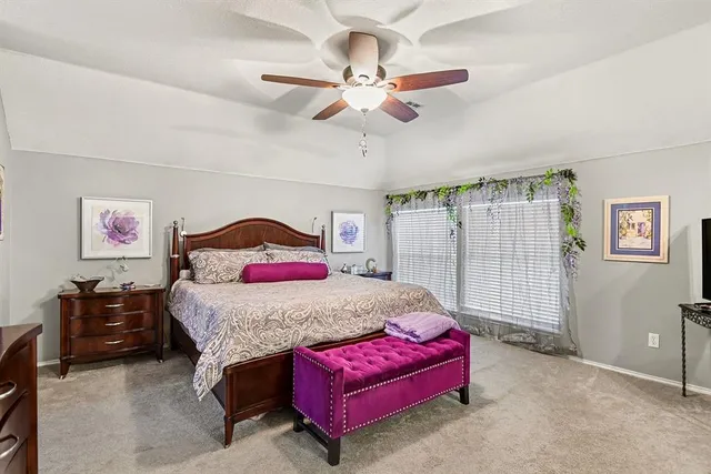 a bedroom with a bed and window