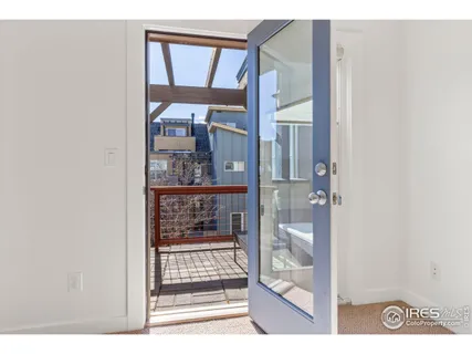 a spacious bedroom with a bed and a couch