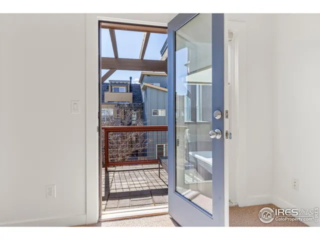 a spacious bedroom with a bed and a couch