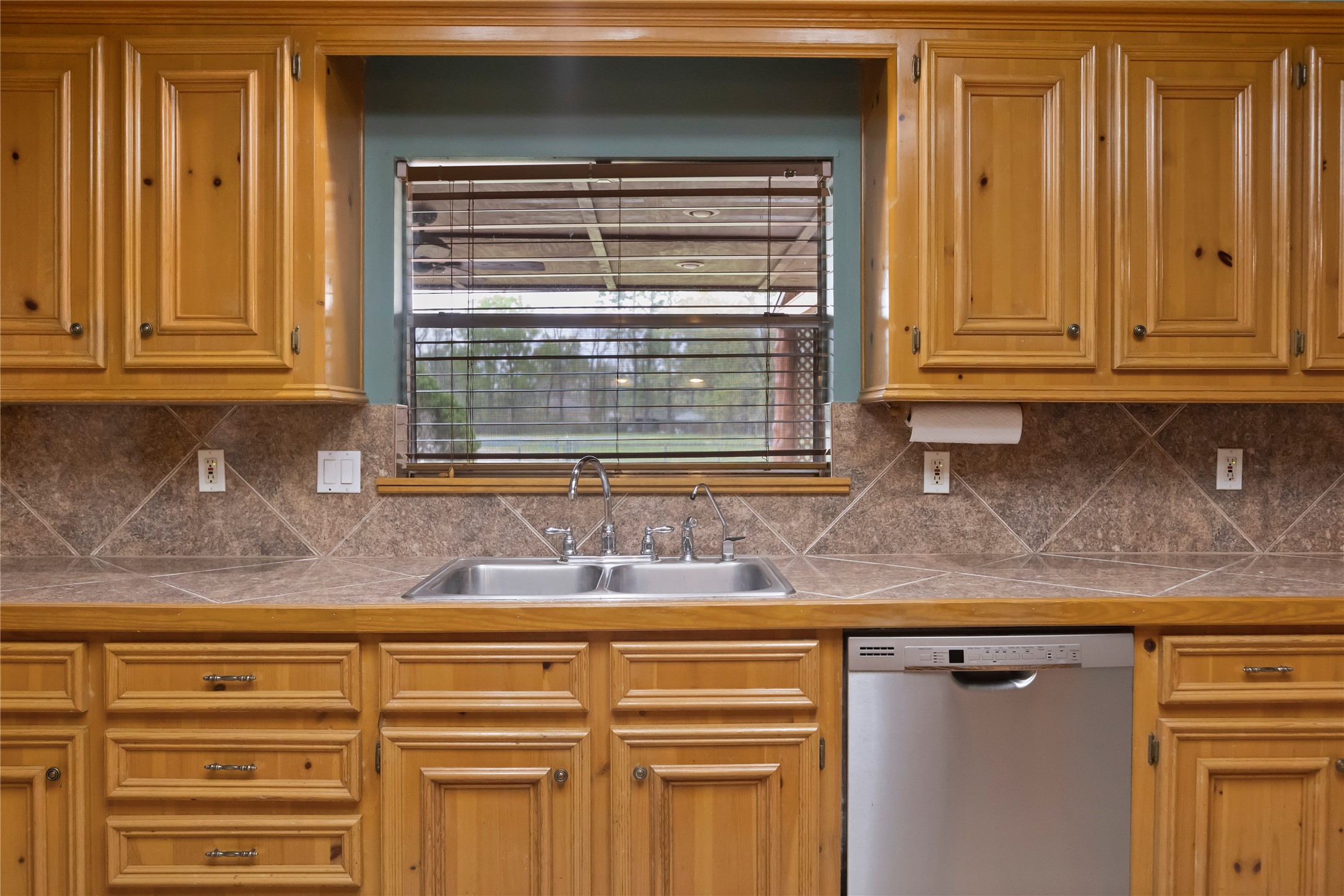 22916 East Martin Drive Porter, TX 77365 - Photo 10 of 43 a kitchen with granite countertop cabinets and window