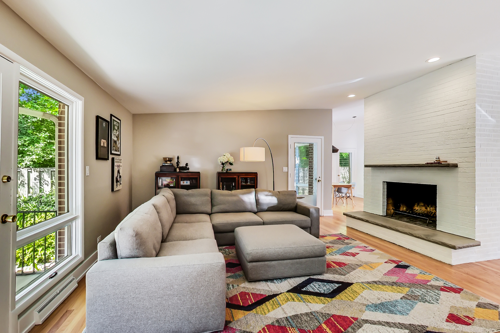 416 Maple Street Winnetka, IL 60093 - Photo 12 of 34 a living room with furniture and a fireplace