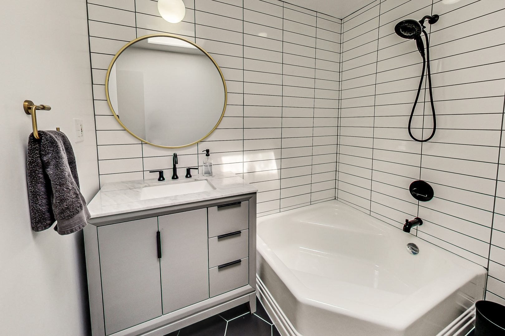 416 Maple Street Winnetka, IL 60093 - Photo 18 of 34 a bathroom with a sink and a mirror