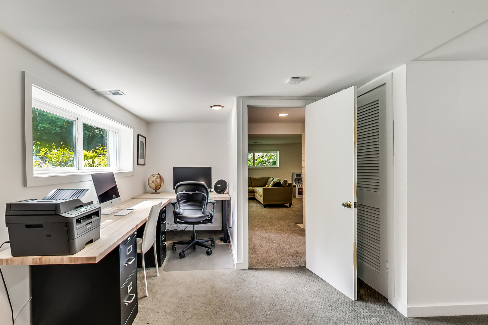 416 Maple Street Winnetka, IL 60093 - Photo 24 of 34 a view of a workspace with furniture and a window