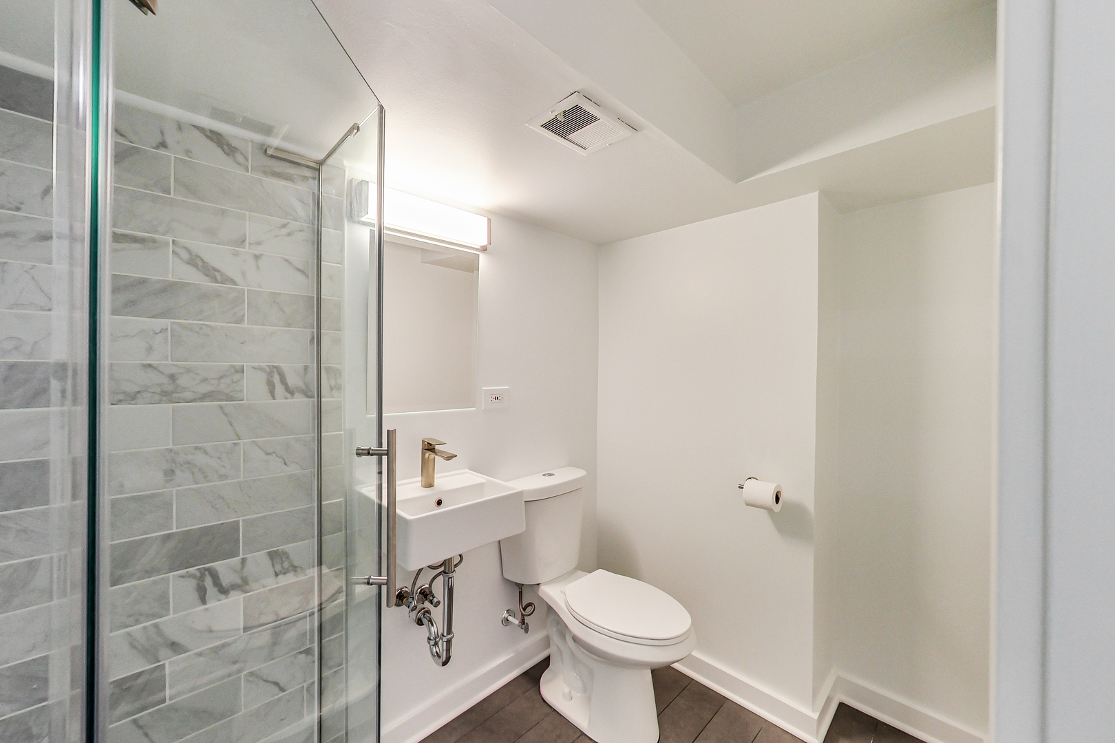 416 Maple Street Winnetka, IL 60093 - Photo 26 of 34 a bathroom with a toilet a sink and shower