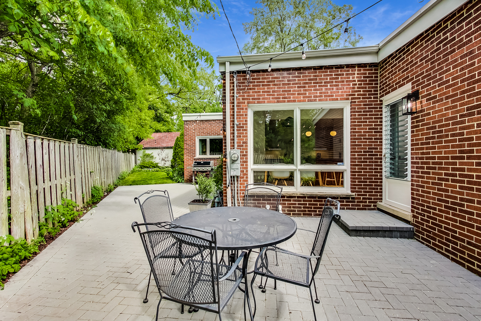 416 Maple Street Winnetka, IL 60093 - Photo 29 of 34 a view of house with backyard and sitting area