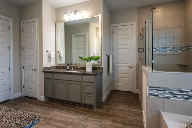 a bathroom with a bathtub and a shower