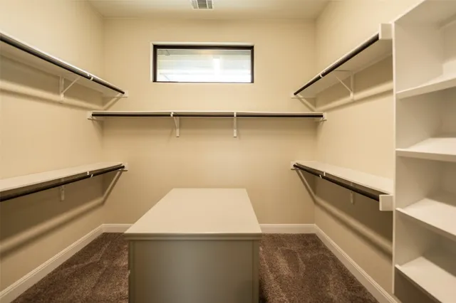 a bed room with a bed and a window