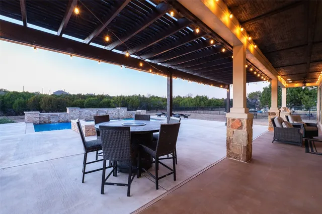 a living room with furniture and a ceiling fan