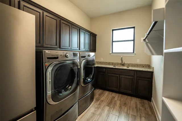 a kitchen with granite countertop wood cabinets and stainless steel appliances