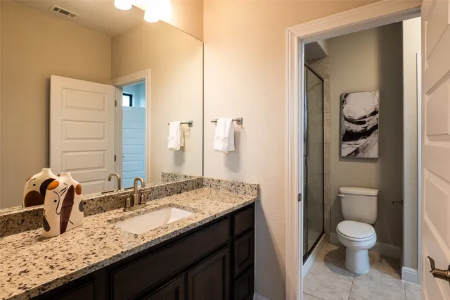 a view of a livingroom with furniture and hardwood floor