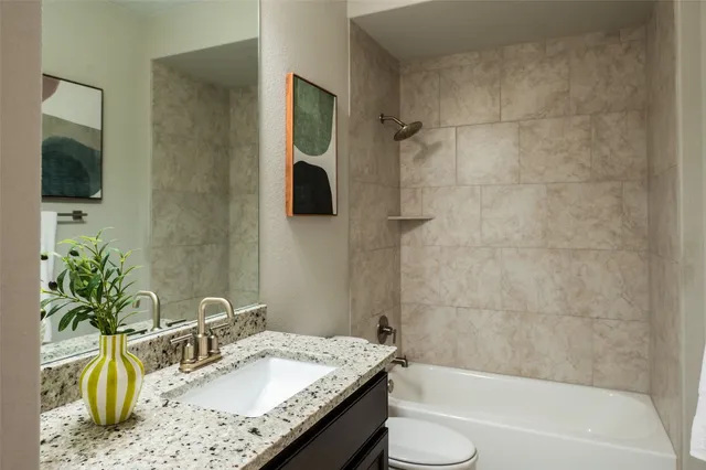 an aerial view of a houses with a city street view