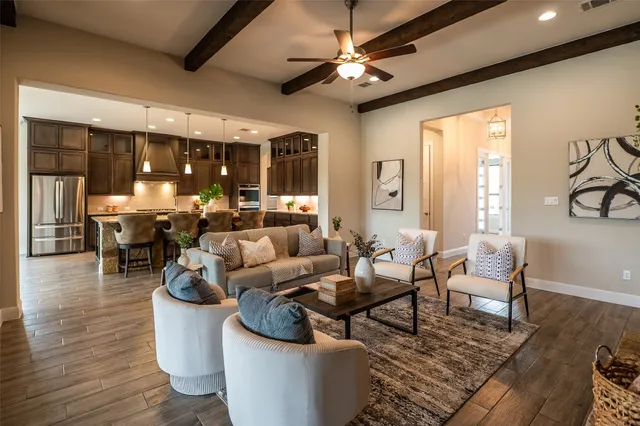 a living room with furniture fireplace and flat screen tv