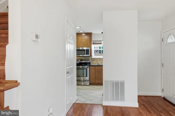 a view of kitchen and wooden floor