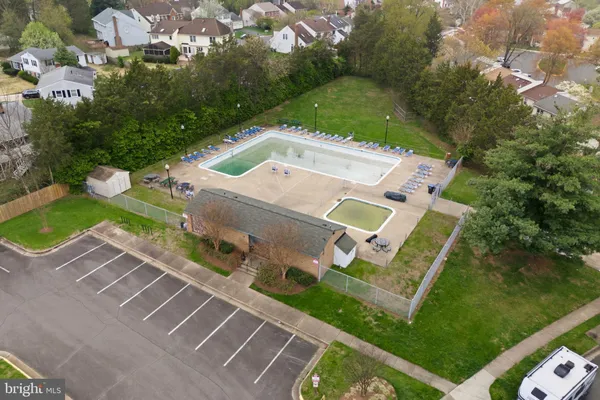 an aerial view of residential house with outdoor space and swimming pool