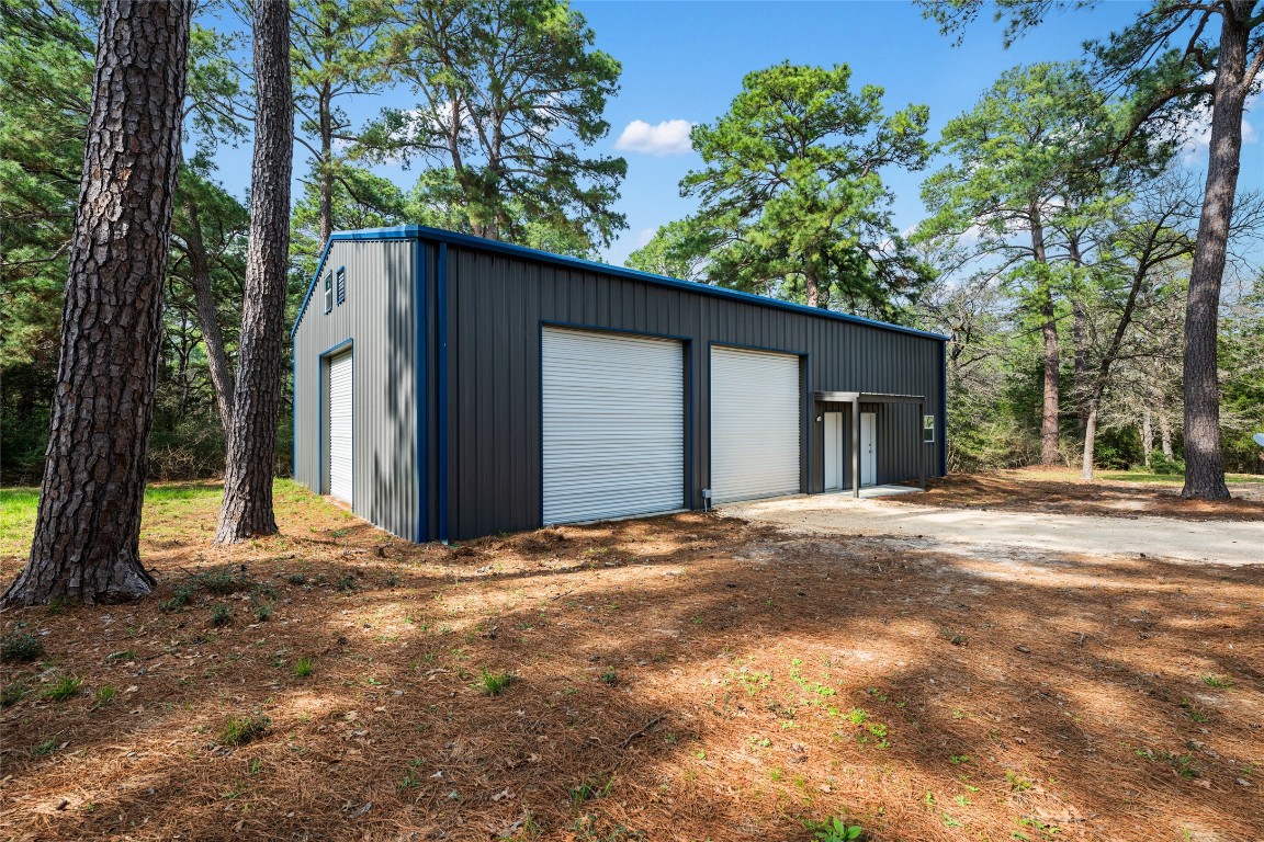 a view of a house with a tree in front of it