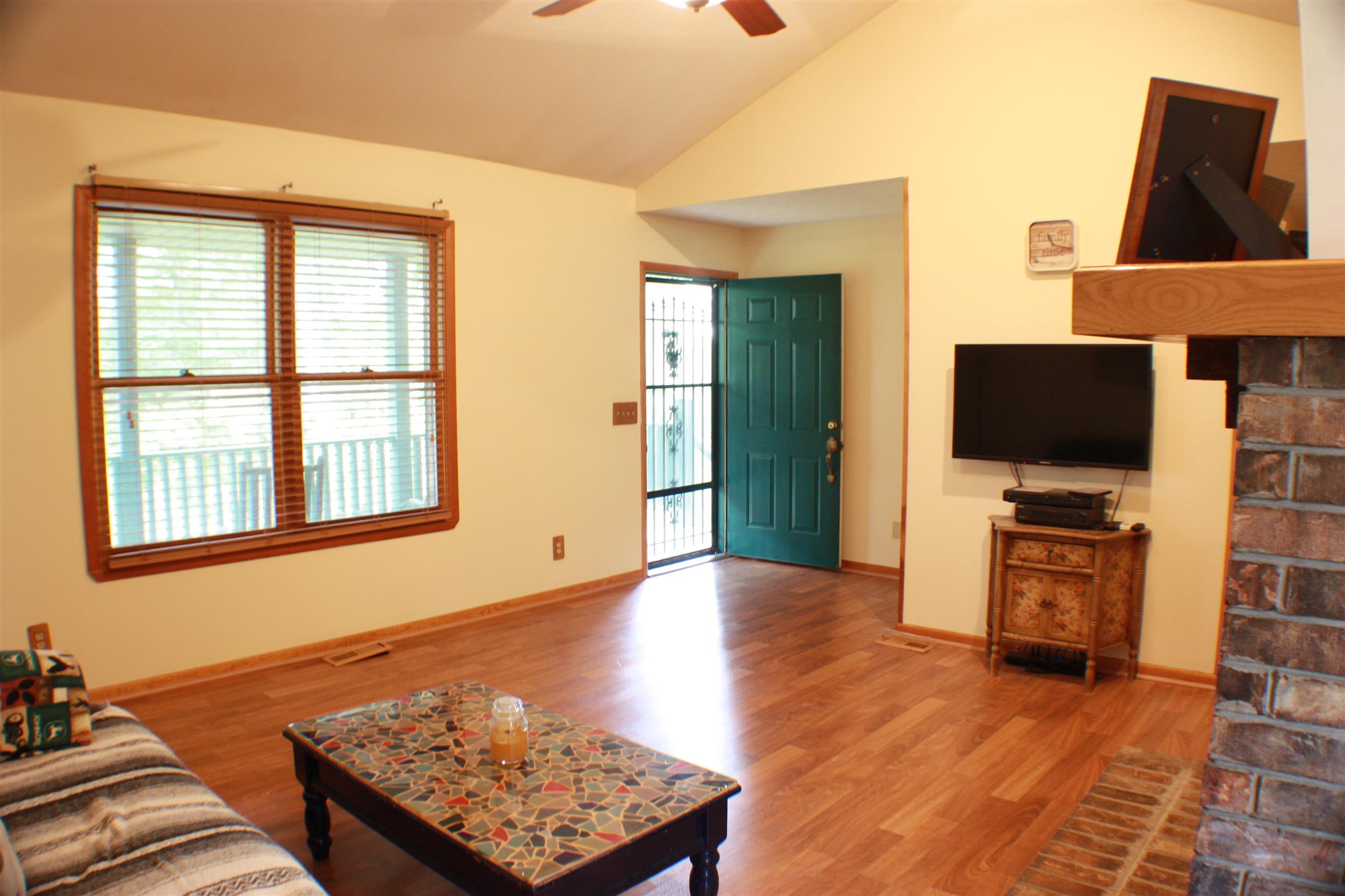 201 Vantrease Road Cottontown, TN 37048 - Photo 6 of 13 a living room with furniture and a flat screen tv