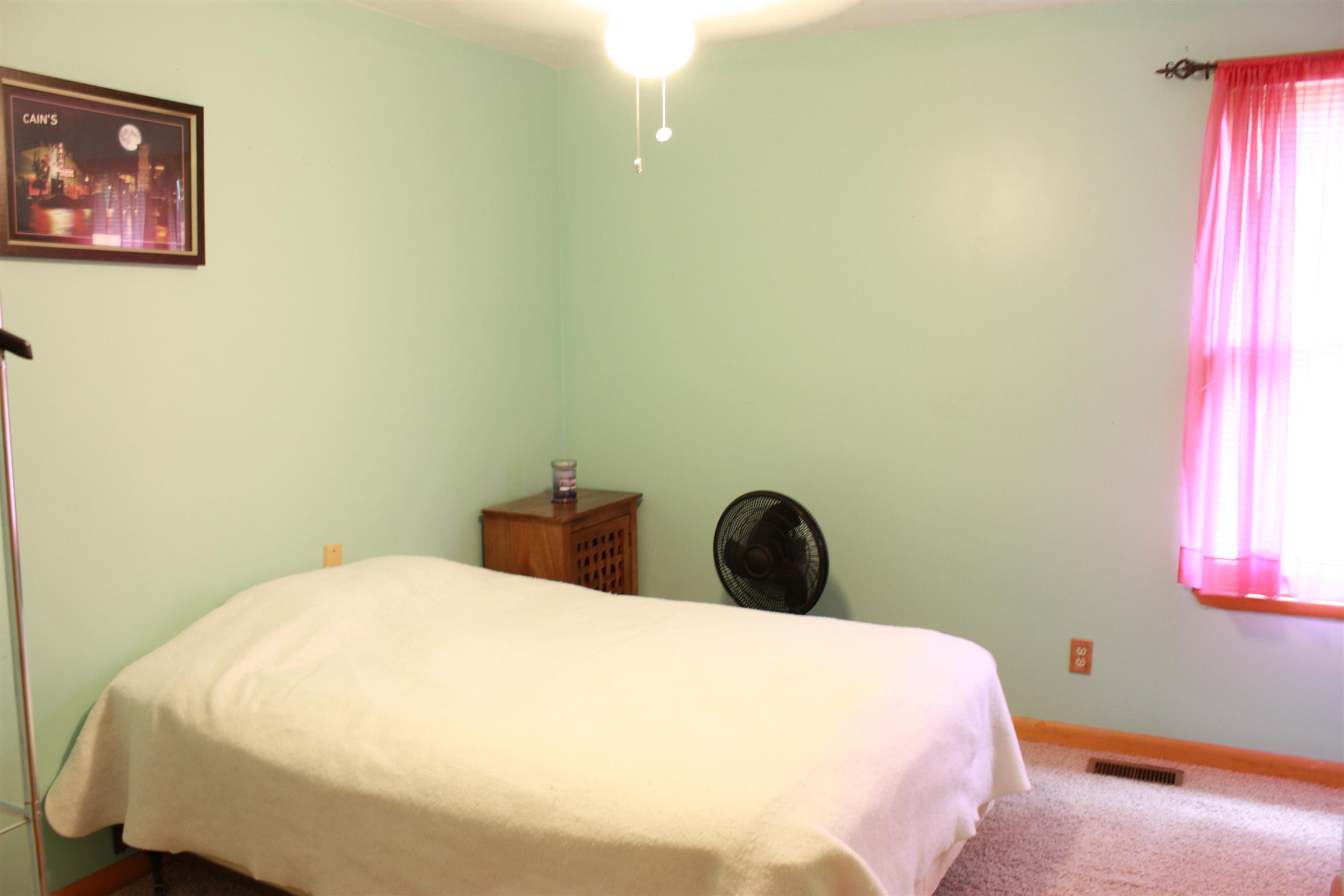 201 Vantrease Road Cottontown, TN 37048 - Photo 10 of 13 a bedroom with a bed and a window