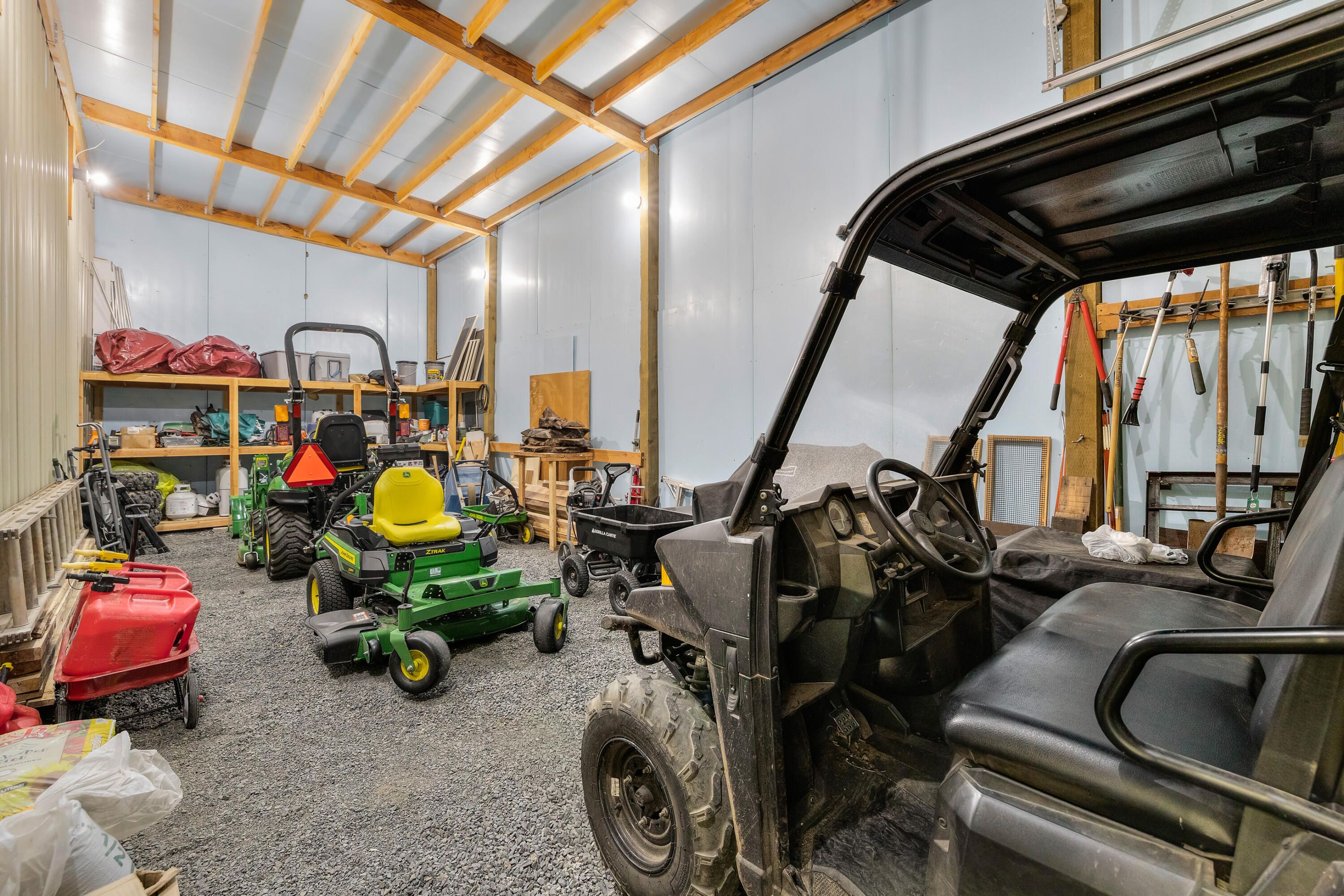 64145 Hunnell Road Bend, OR 97703 - Photo 43 of 65 A second shop bay provides excellent flexibility for equipment, vehicles, tools or hobby use, with high ceilings, generous work area and room to organize acreage essentials.