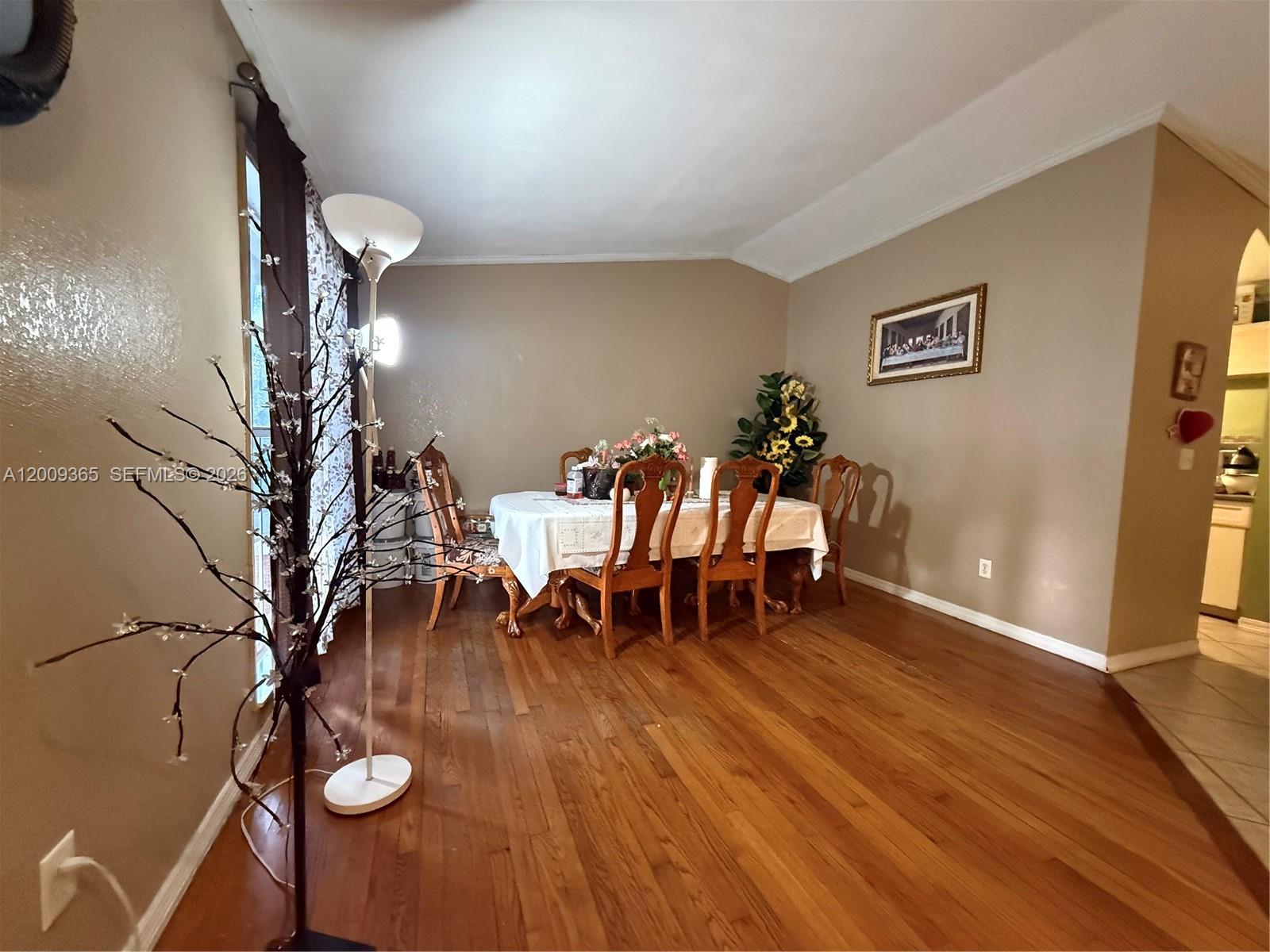 25835 Southwest 131st Court Homestead, FL 33032 - Photo 11 of 33 a dining room with furniture and wooden floor
