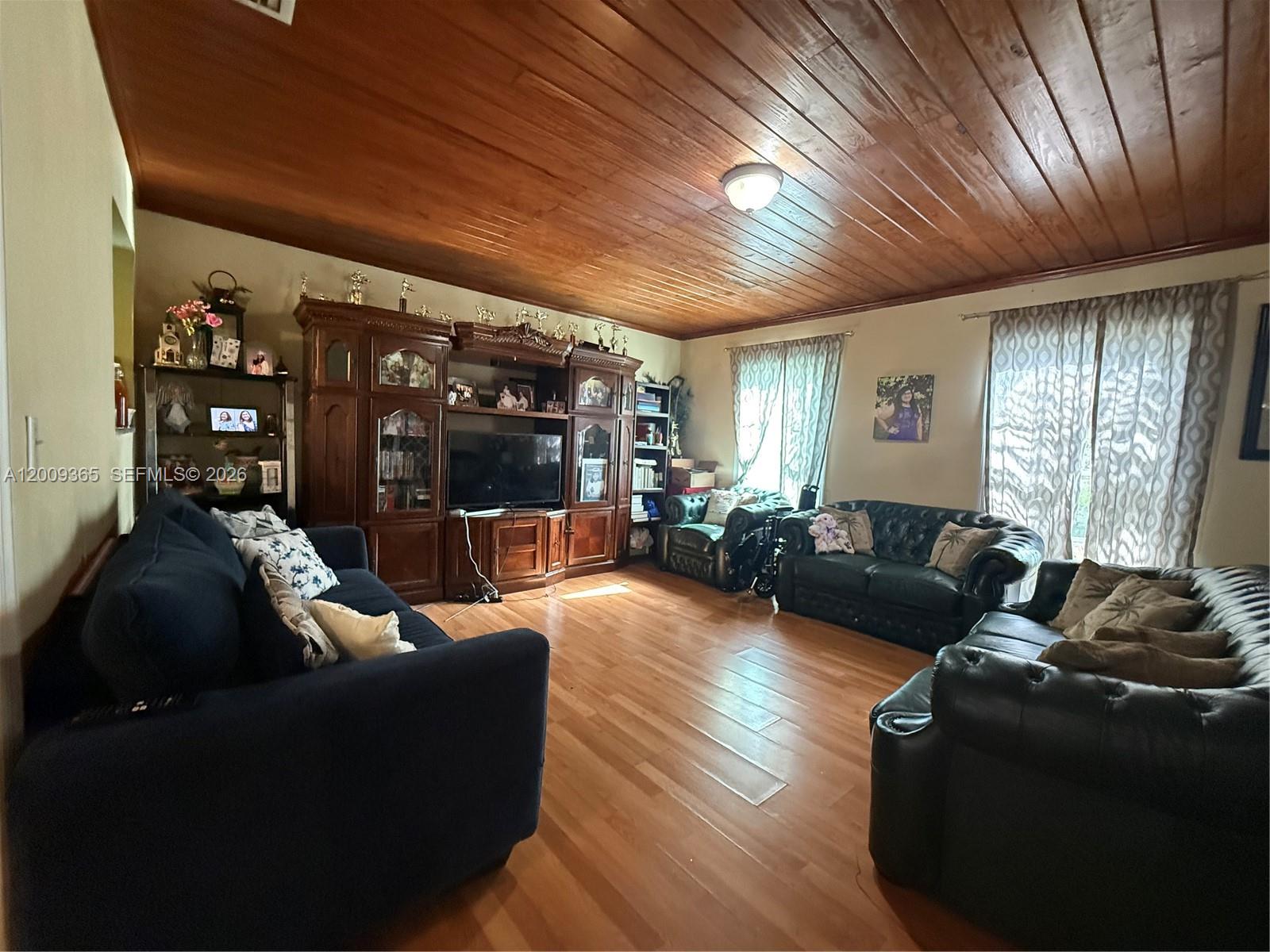 25835 Southwest 131st Court Homestead, FL 33032 - Photo 13 of 33 a living room with furniture and a large window