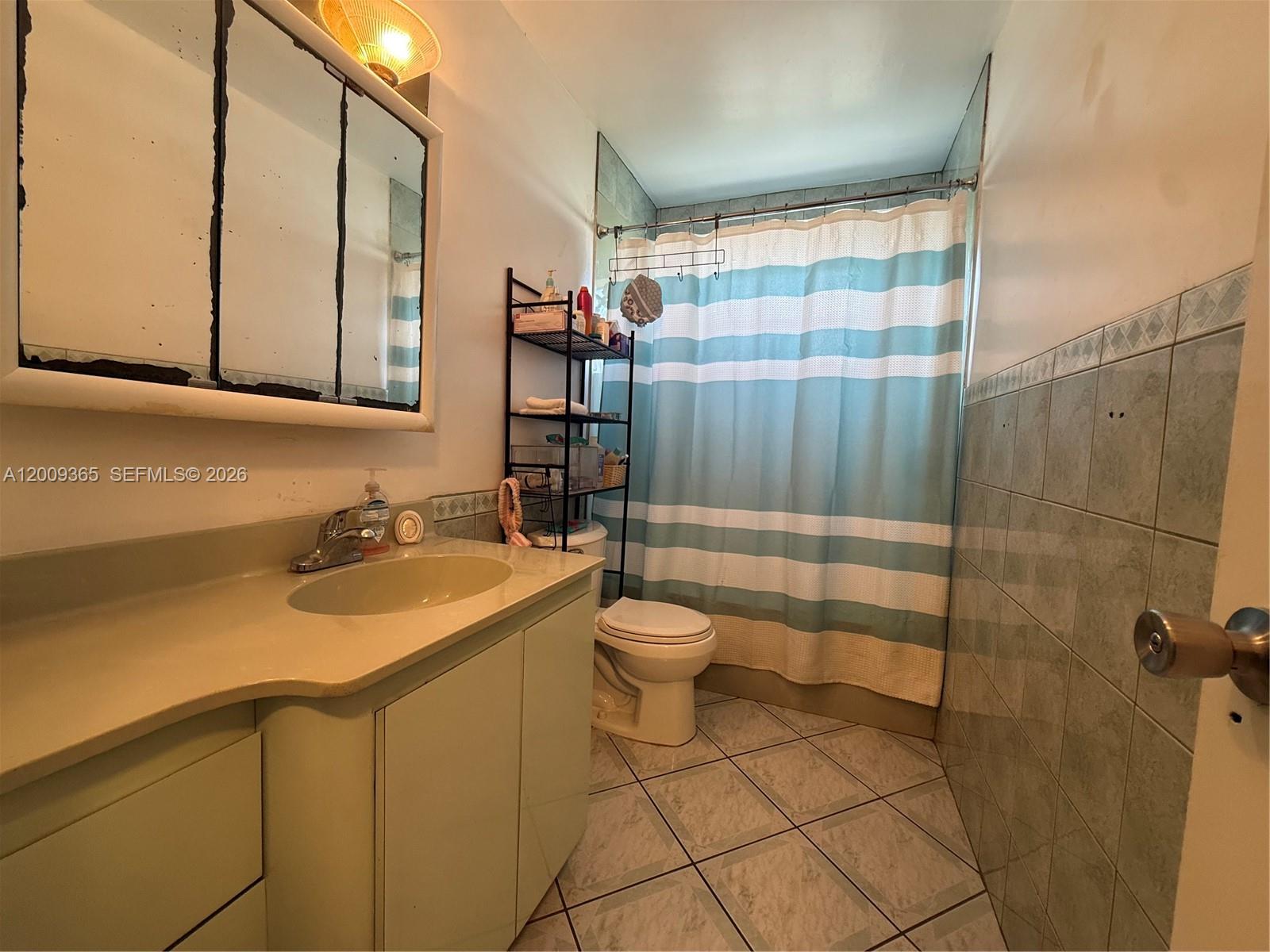 25835 Southwest 131st Court Homestead, FL 33032 - Photo 16 of 33 a bathroom with a sink toilet and shower
