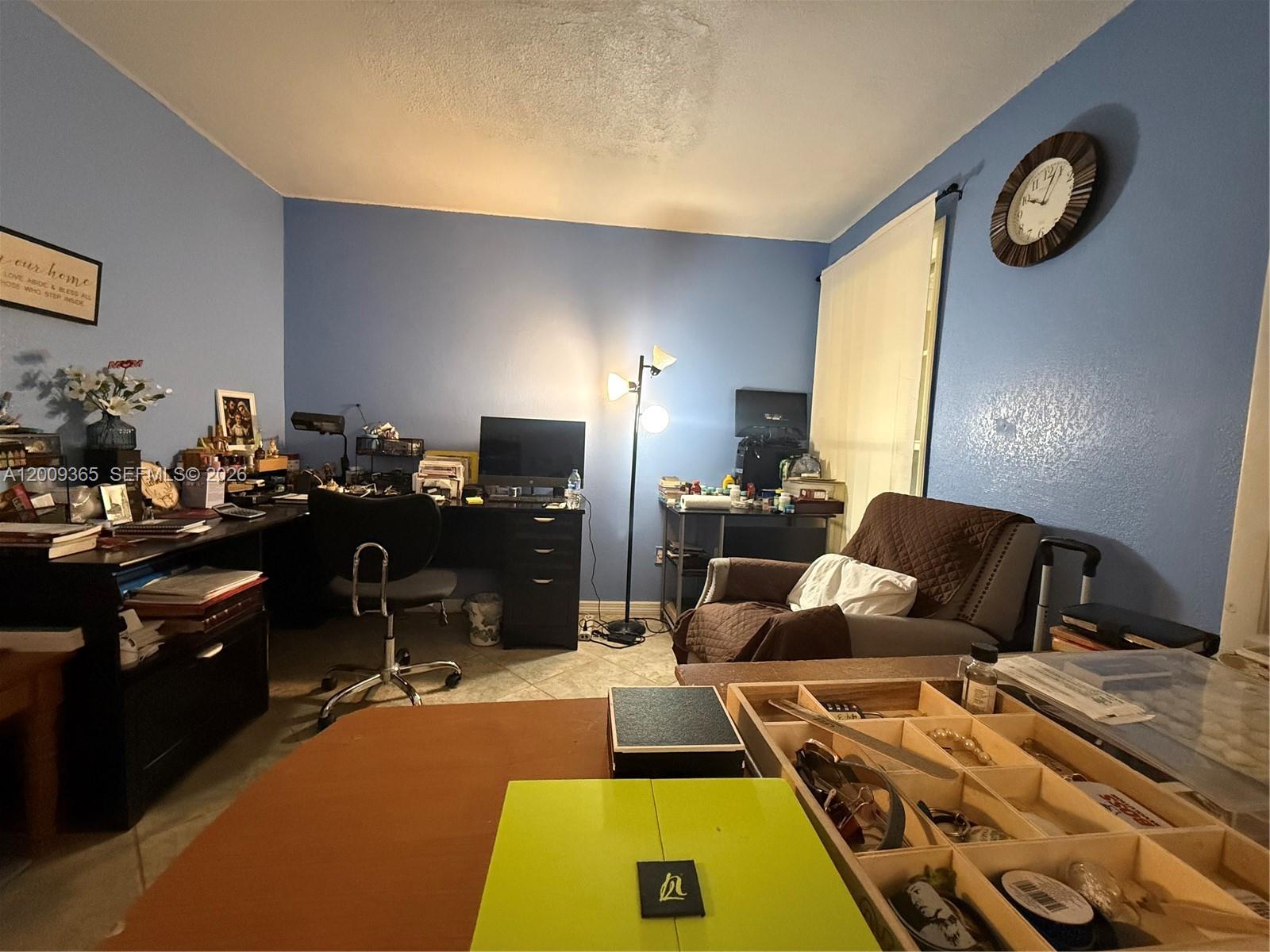 25835 Southwest 131st Court Homestead, FL 33032 - Photo 17 of 33 a room with furniture and a flat screen tv