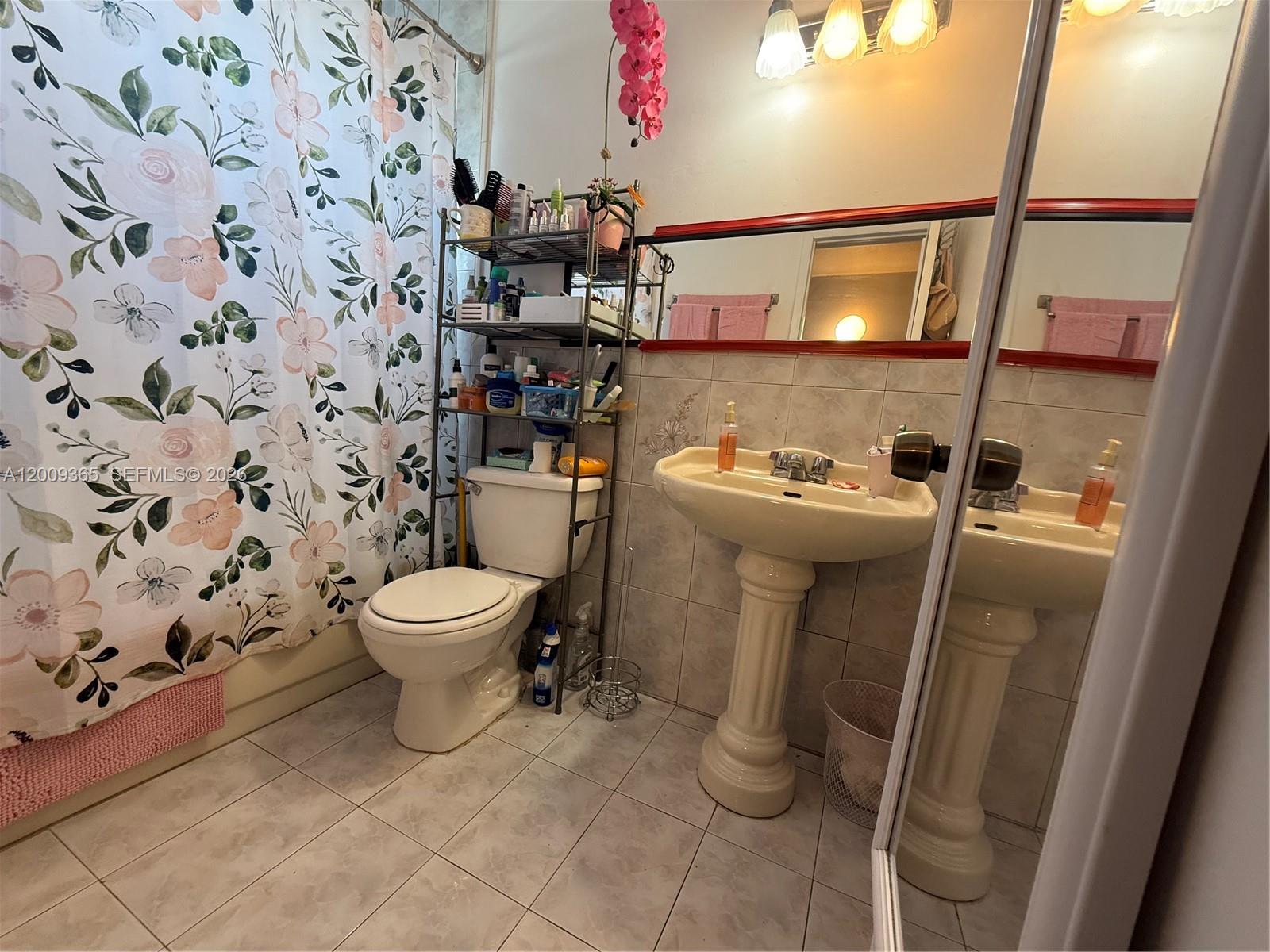 25835 Southwest 131st Court Homestead, FL 33032 - Photo 19 of 33 a bathroom with a sink toilet and shower