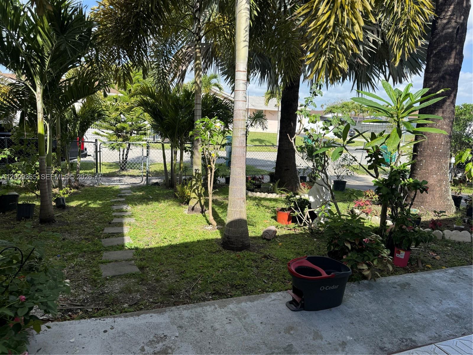 25835 Southwest 131st Court Homestead, FL 33032 - Photo 27 of 33 a view of a garden with palm trees