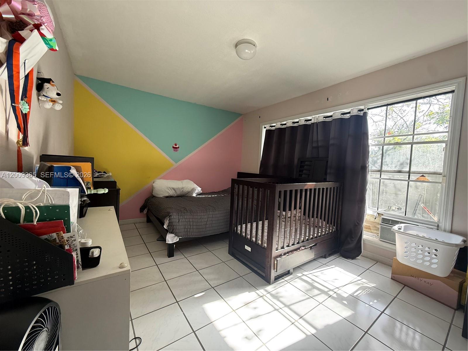 25835 Southwest 131st Court Homestead, FL 33032 - Photo 8 of 33 a room with lots of white furniture and a window