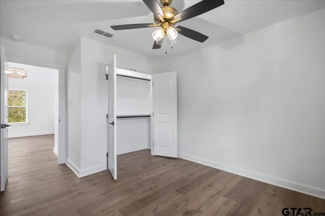 wooden floor with white walls