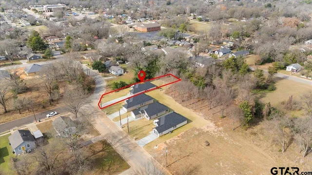 a view of a kitchen with microwave and windows